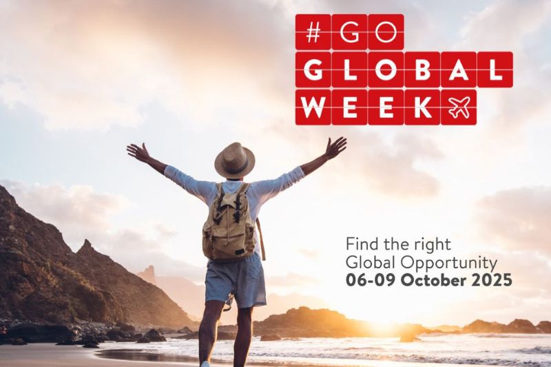 Man standing in hat and shorts and wearing a backpack opens his arms to the rising or setting sun on a quiet beach. Image includes text #GoGlobalWeek and 'Find the right global opportunity / 06-09 October 2025'.